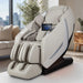 Taupe Osaki Kairos Duo massage chair placed in a living room, showing it next to a side table and soft lighting, evoking a cozy relaxation spot.