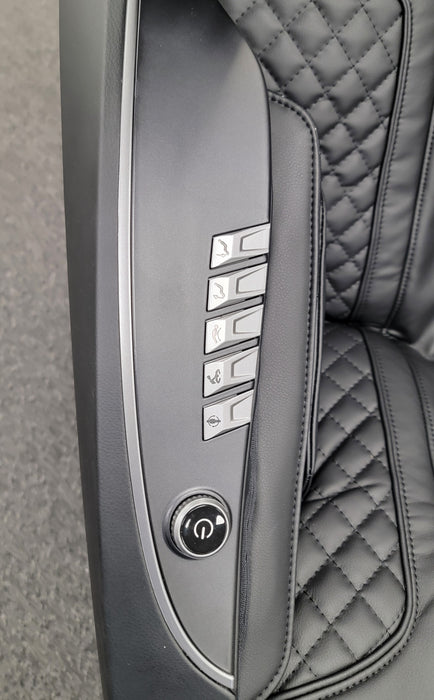 Close-up image of the quick access control panel on the Osaki Solis 4D Massage Chair, showcasing intuitive buttons for easy adjustment of massage functions, intensity, and chair settings for a seamless user experience.