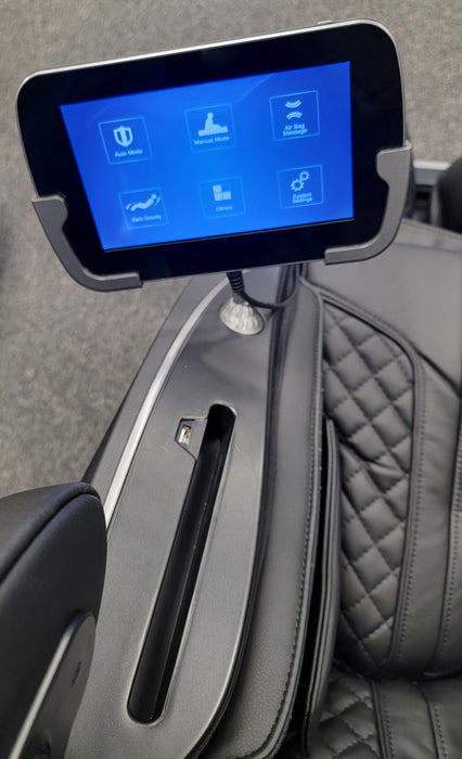 Close-up image of the touchscreen tablet remote for the Osaki Solis 4D Massage Chair, featuring a user-friendly interface with easy-to-navigate controls for adjusting massage settings, intensity, and chair position for a personalized experience.