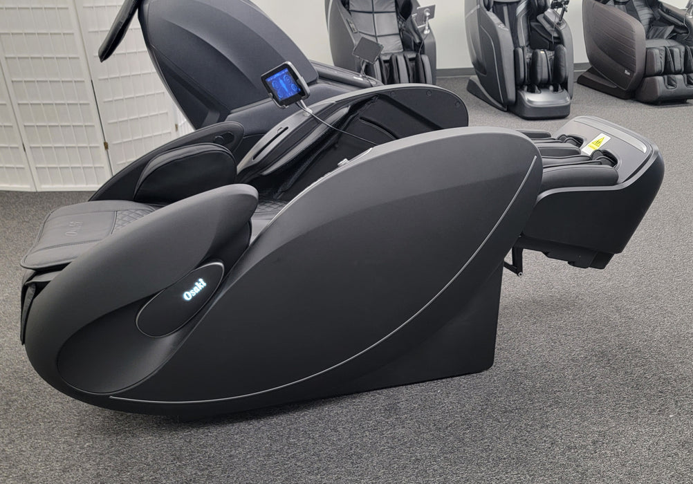 Image of the Osaki Solis 4D Massage Chair performing the inversion stretch, with the chair tilted backward to provide a gentle stretch for the spine and enhance flexibility, offering a soothing and effective way to relieve tension.