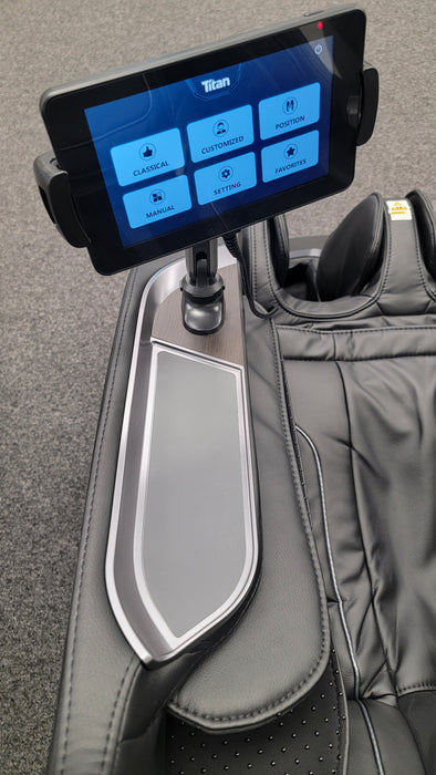 Touchscreen controller of the Titan TP-Ronin 4D Massage Chair, displaying user-friendly controls for customizing massage settings and features.