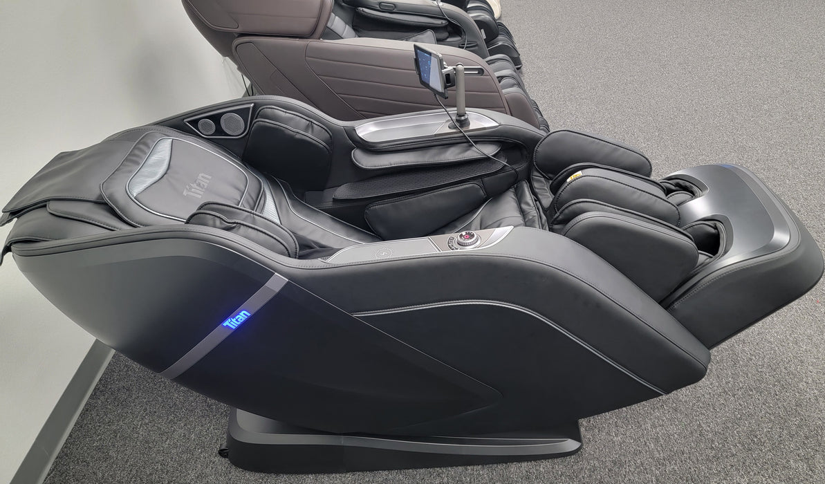 Titan TP-Ronin 4D Massage Chair in Zero Gravity position, emphasizing its ergonomic design that helps reduce spinal pressure and enhance overall relaxation.