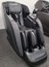 Titan TP-Ronin 4D Massage Chair in black, featuring a sleek design with advanced massage technology, adjustable features, and Bluetooth HD surround speakers.