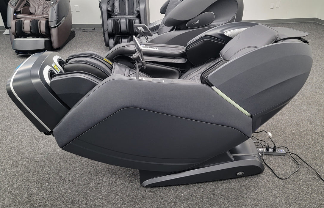 Osaki Manhattan Duo Mech 4D massage chair in a fully reclined zero gravity position, emphasizing its ergonomic design, luxurious black finish, and advanced 4D massage capabilities for ultimate comfort and relaxation.