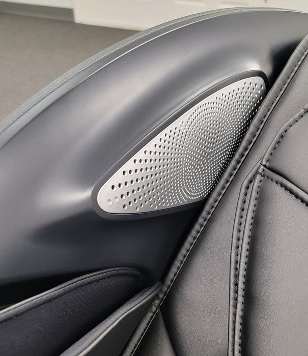 Close-up of the surround sound Bluetooth speakers on the Osaki Manhattan Duo Mech 4D Massage Chair, offering high-quality audio for a fully immersive relaxation experience.