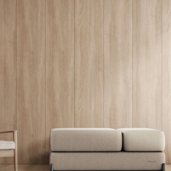 Modern interior with a beige Ceragem S4 massage lounger and chair against a wooden paneled wall.