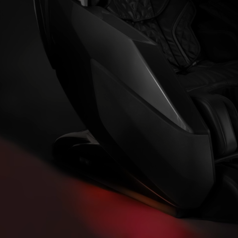Massage chair with glowing LED chromotherapy lights creating a calming ambiance.
