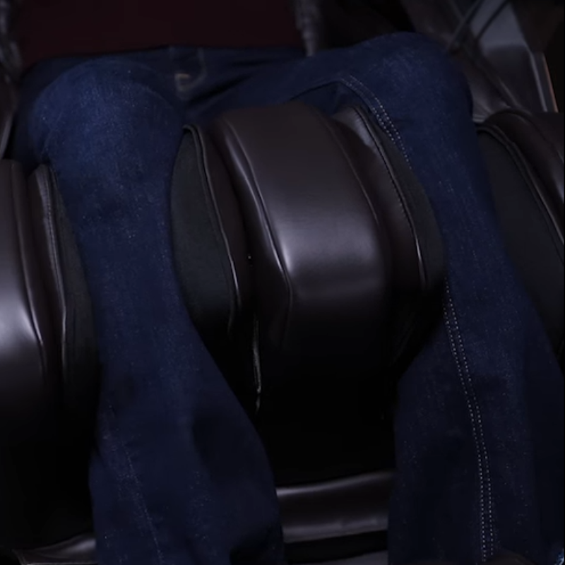Detailed view of calf massage feature with rollers and airbags kneading and oscillating the lower legs.