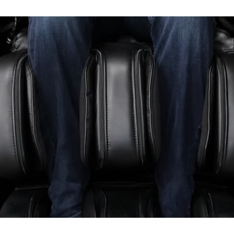Close-up of the Complete Calf™ Kneading + Oscillation system in the Infinity Circadian 4D DualFlex Massage Chair, featuring calf rollers, orbital oscillation, and compression airbags that simulate human hands to relieve tension and improve circulation.