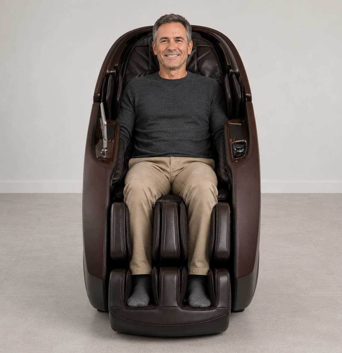 Middle-aged man seated in the chocolate Daiwa Supreme Hybrid massage chair in a contemporary room with gray flooring and white walls.