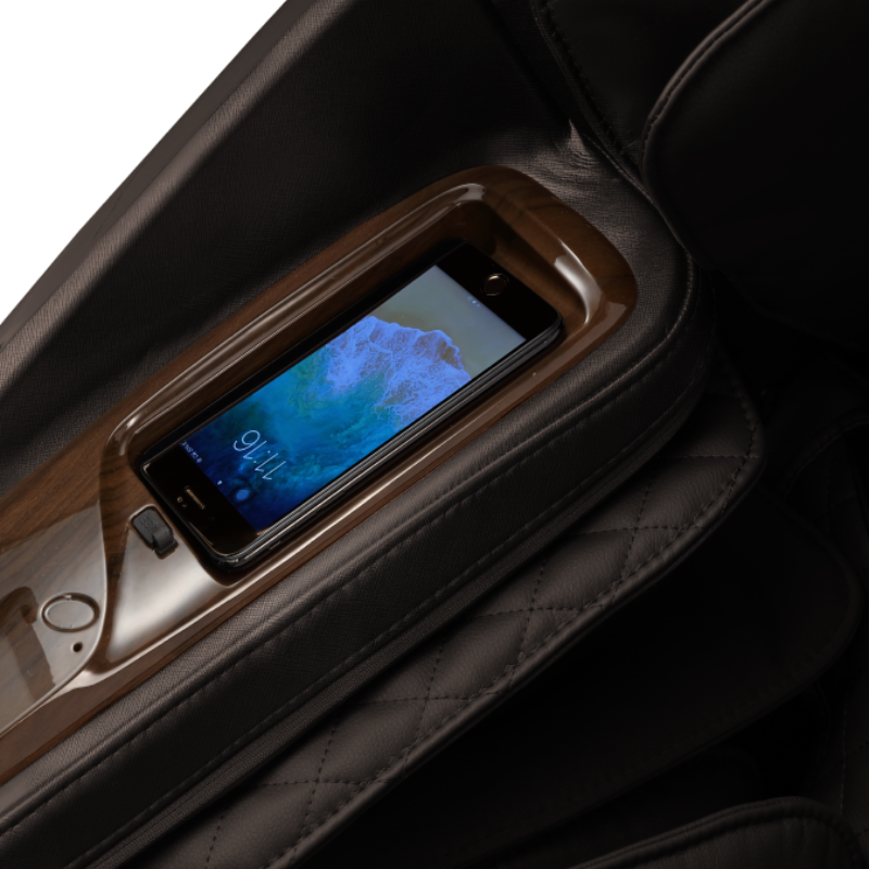 Image showcasing the wireless phone charger and USB port of the Daiwa Supreme Hybrid massage chair, emphasizing the convenient charging options that enable users to effortlessly charge their devices while enjoying a relaxing massage, enhancing both the chair's functionality and overall user experience.