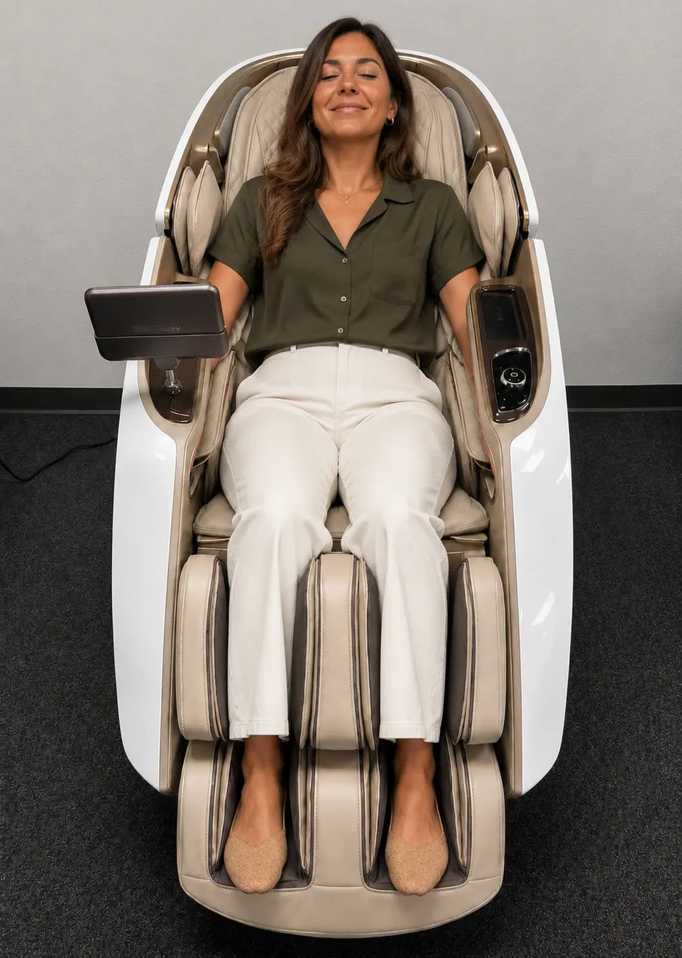 A woman testing the luxury cream Daiwa Supreme Hybrid X massage chair at the Houston, Texas showroom of The Modern Back.