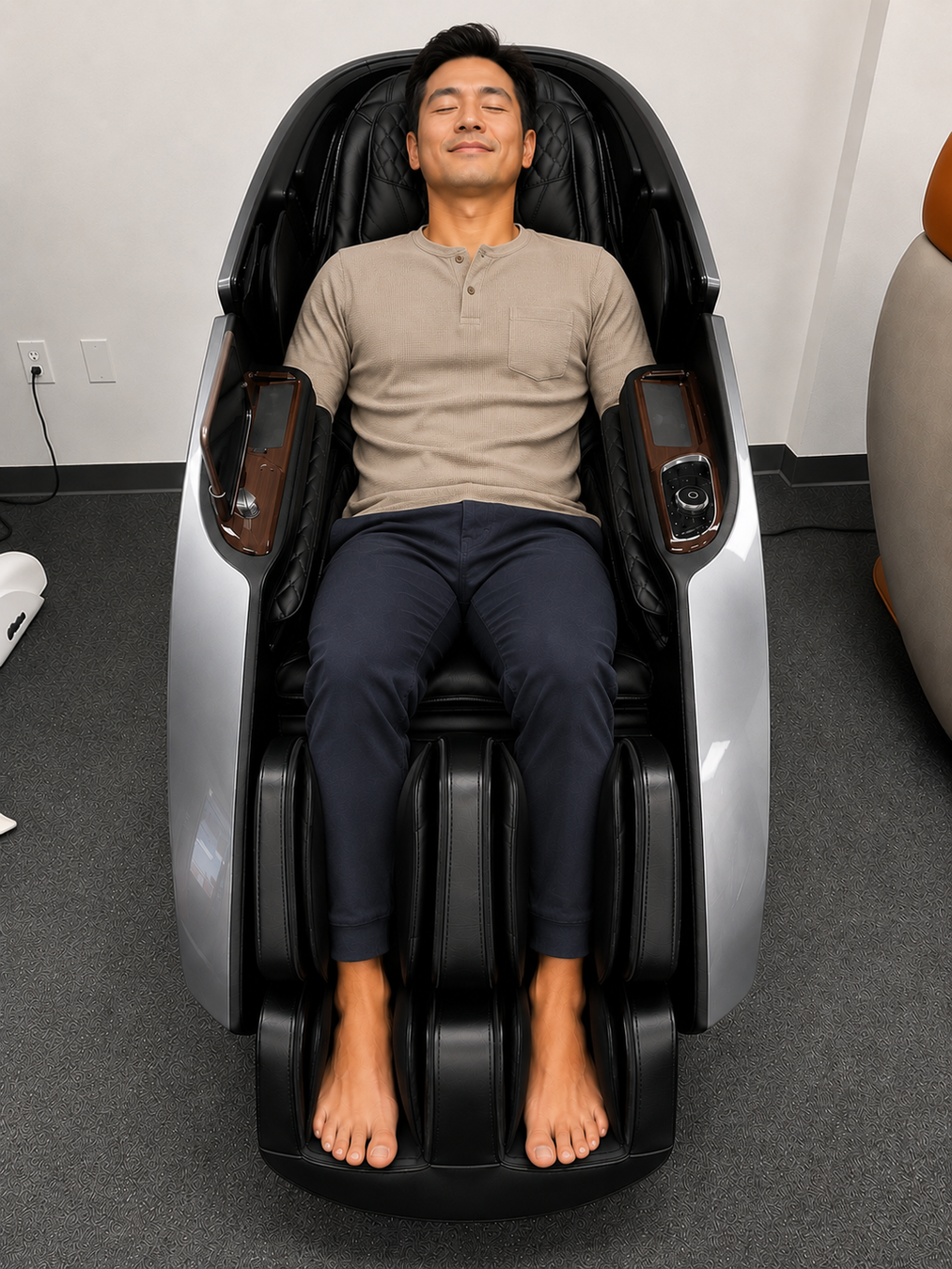 Customer trying out the grey Daiwa Supreme Hybrid X massage chair before purchasing at the Los Angeles area showroom in Gardena, California.