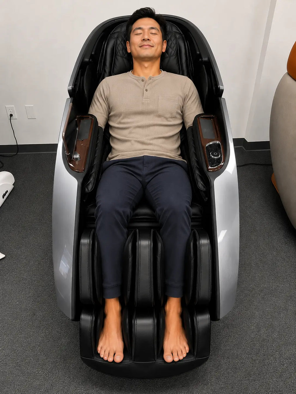 Customer trying out the grey Daiwa Supreme Hybrid X massage chair before purchasing at the Los Angeles area showroom in Gardena, California.