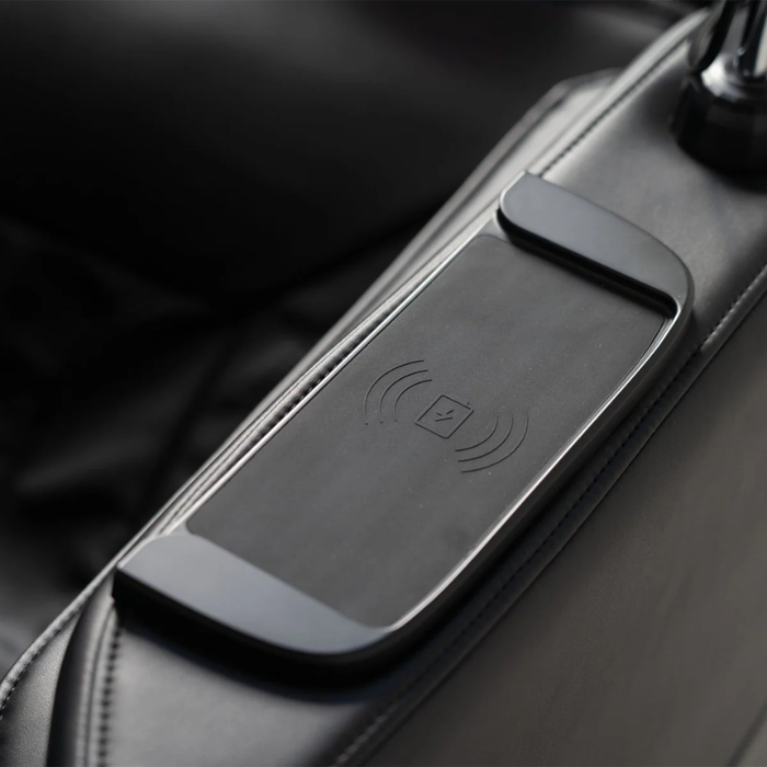 Close-up of Daiwa iLift massage chair wireless charging pad for convenient phone charging during massage.