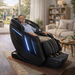 DuoWellness Soteria LE massage chair in black situated in a modern living room setting.