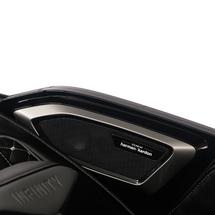 Close-up of the brown Infinity Circadian 4D DualFlex Massage Chair's Bluetooth speakers, seamlessly integrated into the headrest for immersive sound therapy.
