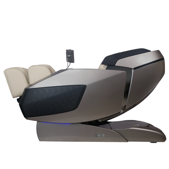 Grey and tan Infinity Ultra Imperial Syner-D massage chair in zero gravity recline position designed for deep relaxation and full-body recovery.