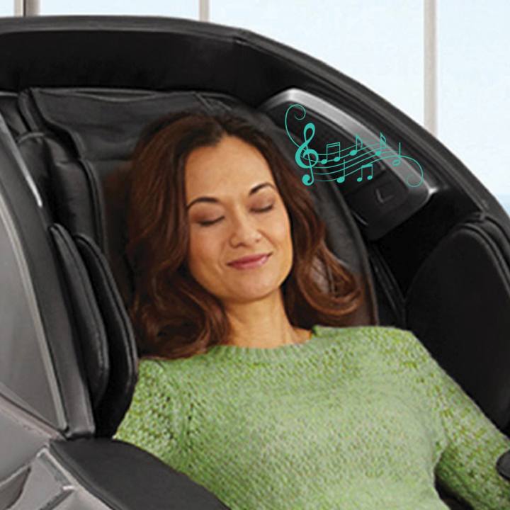 Image of the Infinity Genesis Max massage chair highlighting Bluetooth Technology and USB Charging Station, showing a sleek design with a built-in USB port for device charging and Bluetooth connectivity for streaming music.