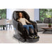Person using brown Kyota Yosei M868 4D massage chair in a living room.