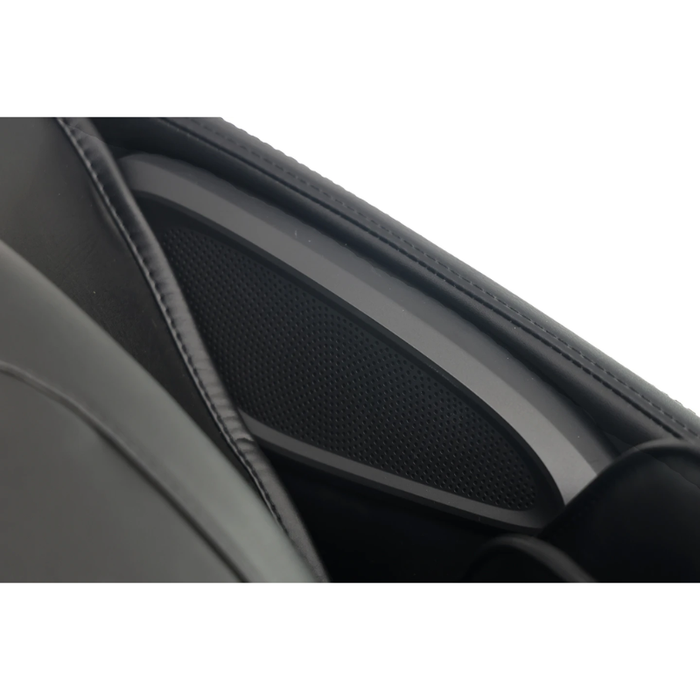 Close-up of the black Kyota Zenyu M338 massage chair’s built-in Bluetooth® speaker integrated into the headrest.
