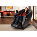 Black Kyota Zenyu M338 massage chair placed in a modern living room setting, showcasing its ergonomic design and luxurious presence.