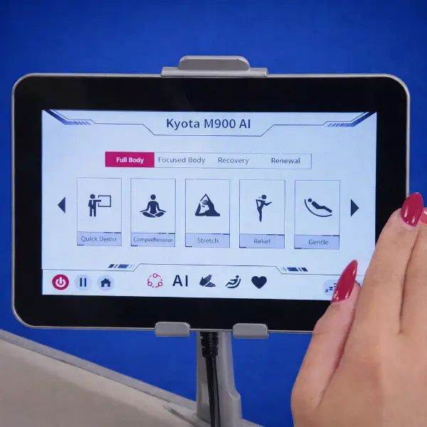 Kyota Hatsumei M900 touchscreen showing auto massage programs including full body, stretch, recovery, and gentle modes.