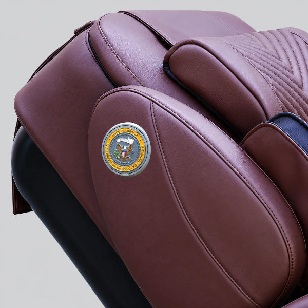 Close-up of the Luraco iRobotics i11 Special Edition Medical Massage Chair in chocolate brown leather, featuring the Made in America emblem and premium stitched upholstery.