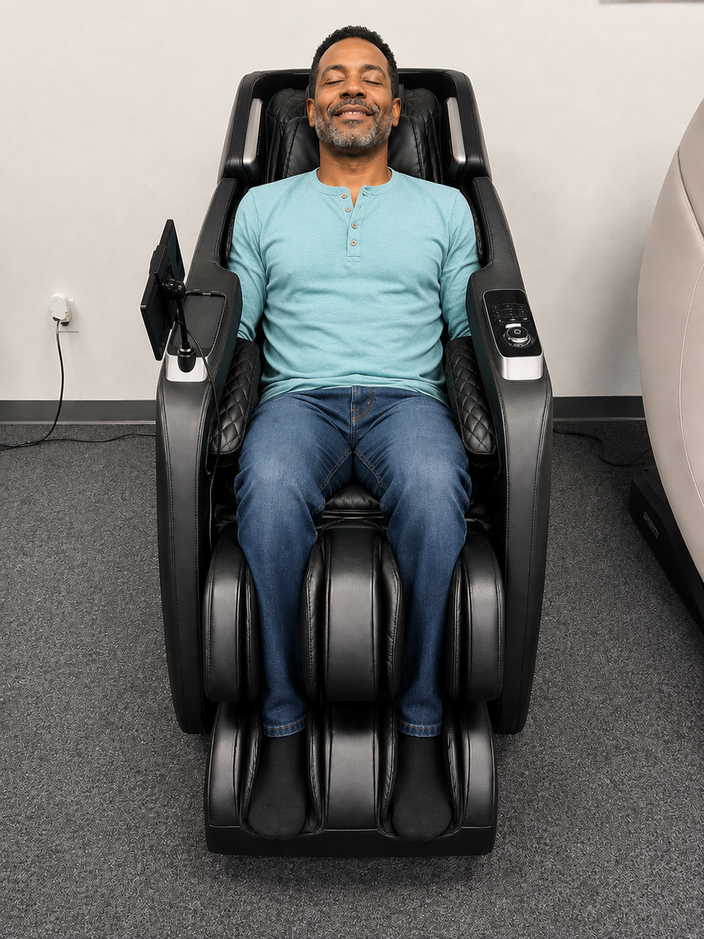 Man testing a luxury massage chair at The Modern Back Orlando showroom before purchasing.