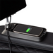 Close-up of the wireless phone charger integrated into the Osaki Bravo Duo 4D massage chair, showcasing its sleek design that allows for convenient device charging while relaxing.