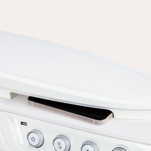 Image highlighting the wireless phone charger feature of the Osaki Duomax open box floor model massage chair, showcasing its built-in charging pad that allows users to conveniently charge their smartphones while enjoying a relaxing massage, enhancing functionality and convenience.