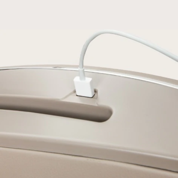 Close-up of the USB phone charger integrated into the Osaki Solis Open Box Floor Model massage chair, showcasing its convenient design for charging devices while enjoying a relaxing massage.