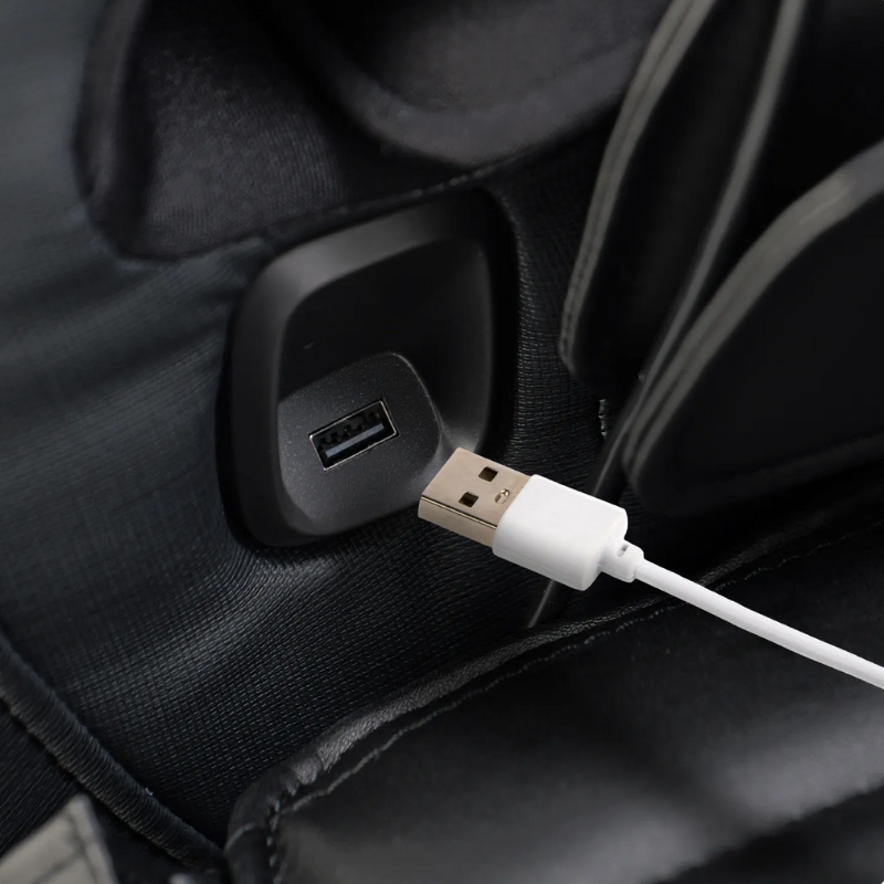 Close-up of Osaki YogaFlex 4D massage chair USB charging port for powering devices during use.