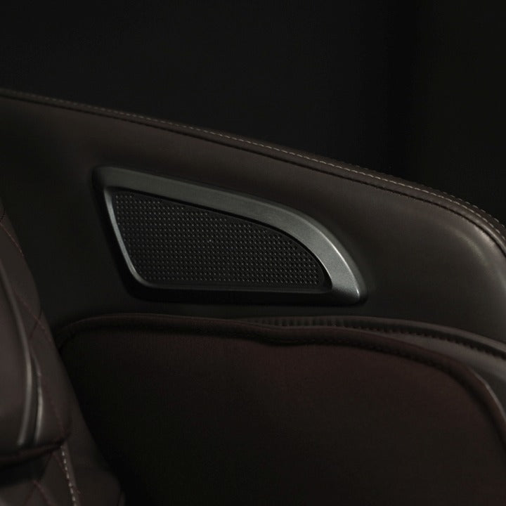 The Infinity Riage 4D Massage Chair is equipped with premium Bluetooth speakers that allow users to enjoy their favorite music or soothing sounds wirelessly, enhancing the overall relaxation experience.