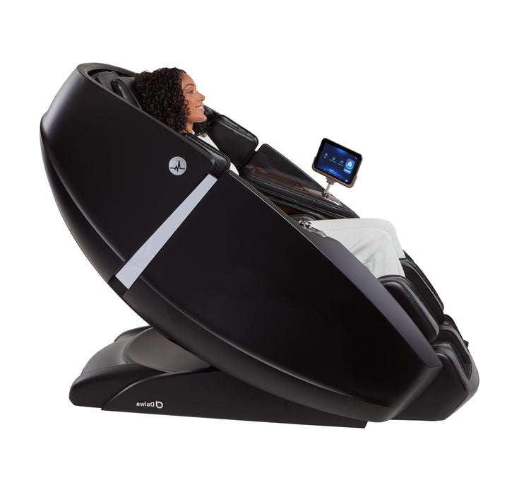 Profile view of the Daiwa Supreme Hybrid X in black with a person seated comfortably, demonstrating the chair's ergonomic fit and full-body coverage.