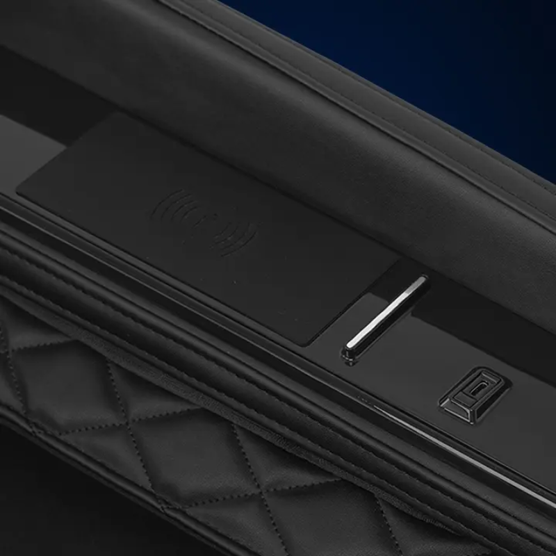 Close-up of the Infinity Solstice Deluxe Massage Chair's wireless charging pad and USB-C port, conveniently located on the armrest, allowing users to wirelessly charge their devices or connect via USB-C for uninterrupted relaxation.