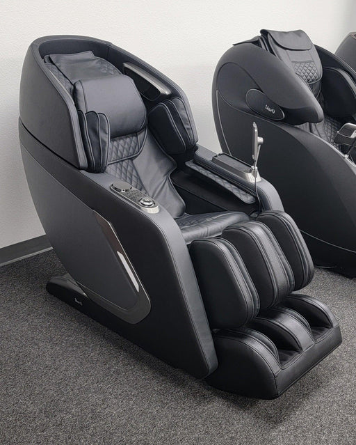 Front view of the Osaki Bravo Duo Open Box Floor Model massage chair in black, displaying its elegant design, soft upholstery, and user-friendly control panel for a personalized massage experience.